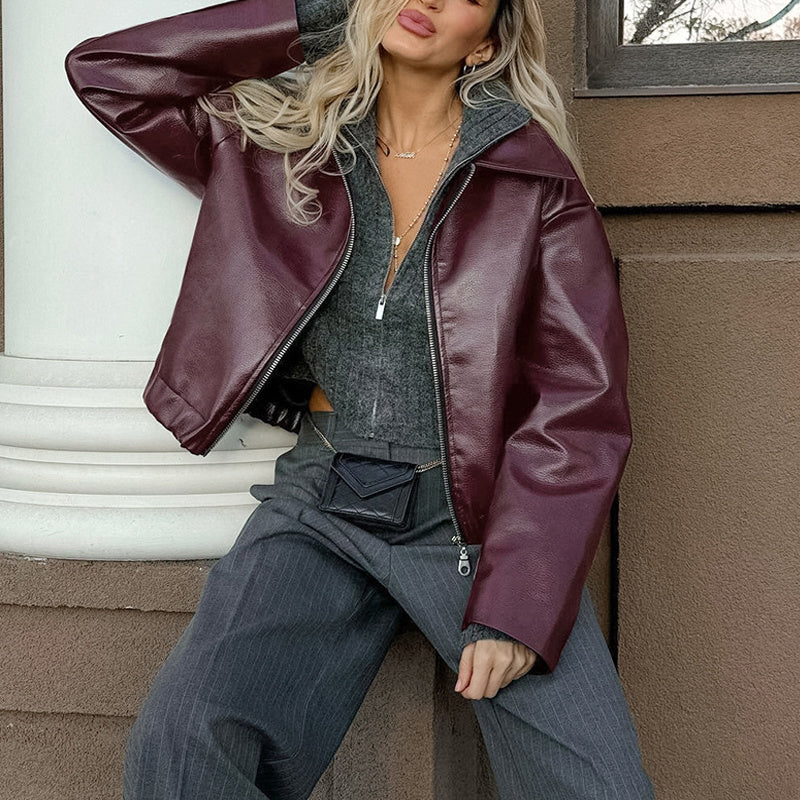 Vintage style women's solid color faux leather jacket from Plush Fashion Hub, featuring a classic tailored design and smooth finish.