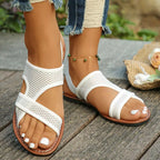 Shopimist crisscross mesh sandals with open toe and flat sole, featuring stylish crisscross straps and breathable design.