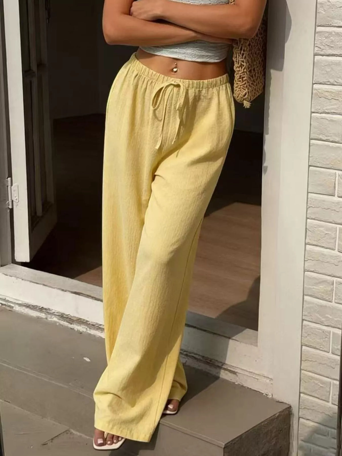 Plus size high-waisted wide-leg pants from Plush Fashion Hub, shown in a stylish, flowing fit with a comfortable waistband.