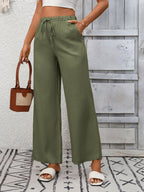 Women's high-waisted wide-leg drawstring pants in soft breathable viscose, shown in a relaxed fit with a comfortable waistband.