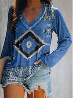 Plus size geometric print V-neck long sleeve T-shirt by Trendsi, featuring a casual style with bold geometric patterns.
