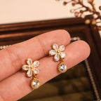 18K gold-plated stainless steel zircon flower drop earrings with intricate petal design and sparkling zircon stones.