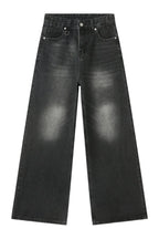 Wide leg jeans with pockets by Trendsi, showing the relaxed fit and classic denim style on a model.