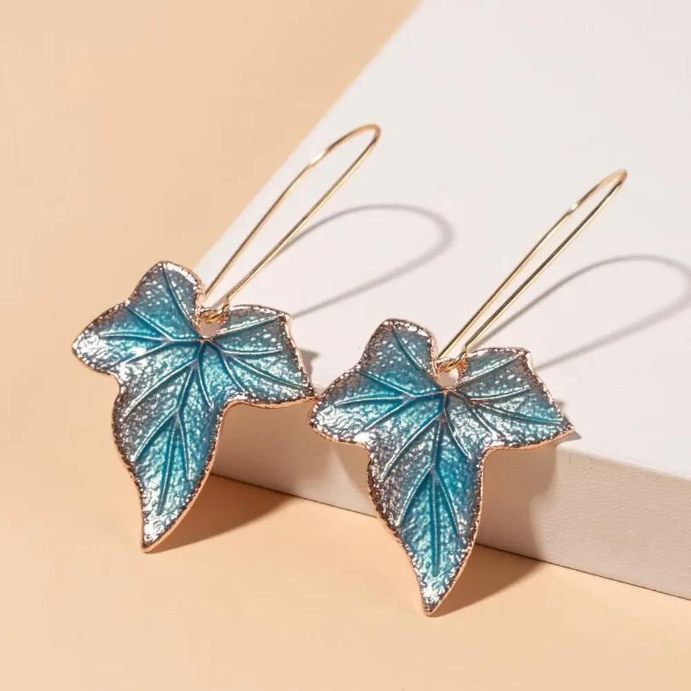 Silver alloy leaf drop earrings featuring elegant leaf-shaped design, perfect for stylish fashion accessories.