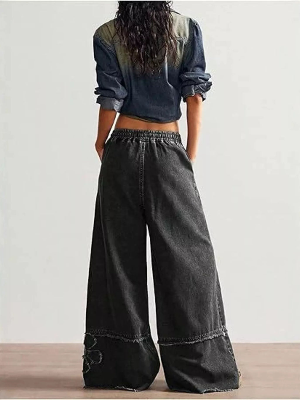 Shopimist floral appliques wide leg jeans showing embroidered floral details on light denim with a relaxed fit.