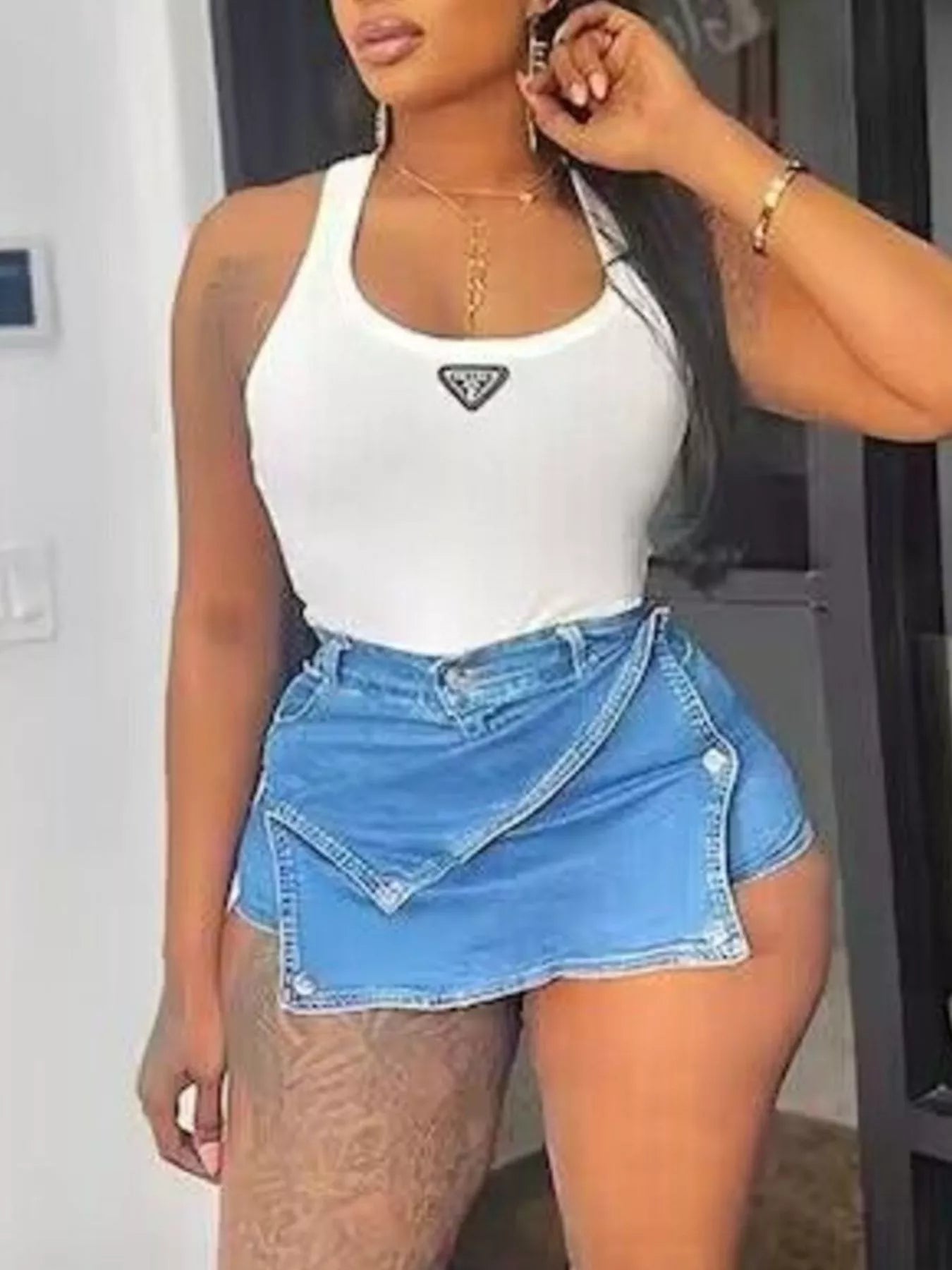 Asymmetrical wrap denim skort by Plush Fashion Hub featuring a stylish, modern design with a flattering fit and distressed details.