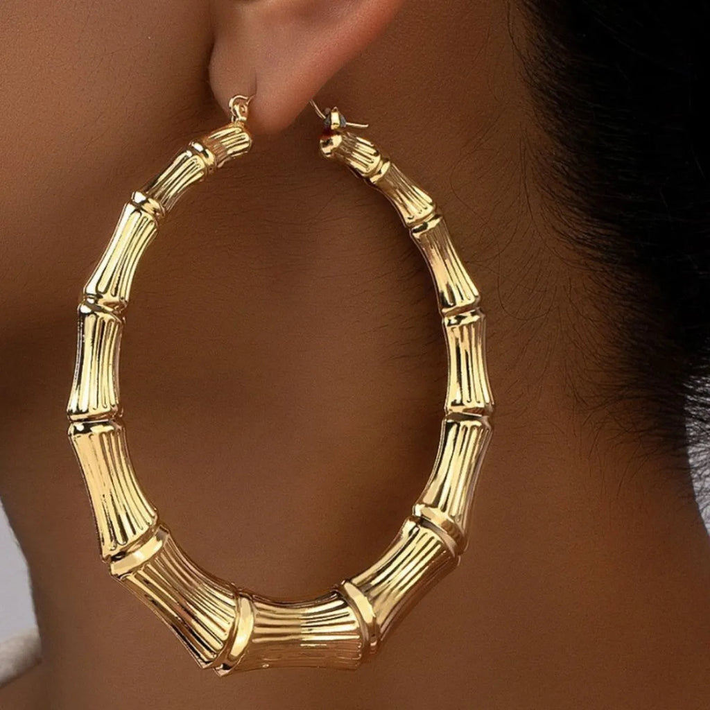 Stainless steel textured hoop earrings by Shopimist, showcasing a close-up of the circular earrings with detailed surface texture.