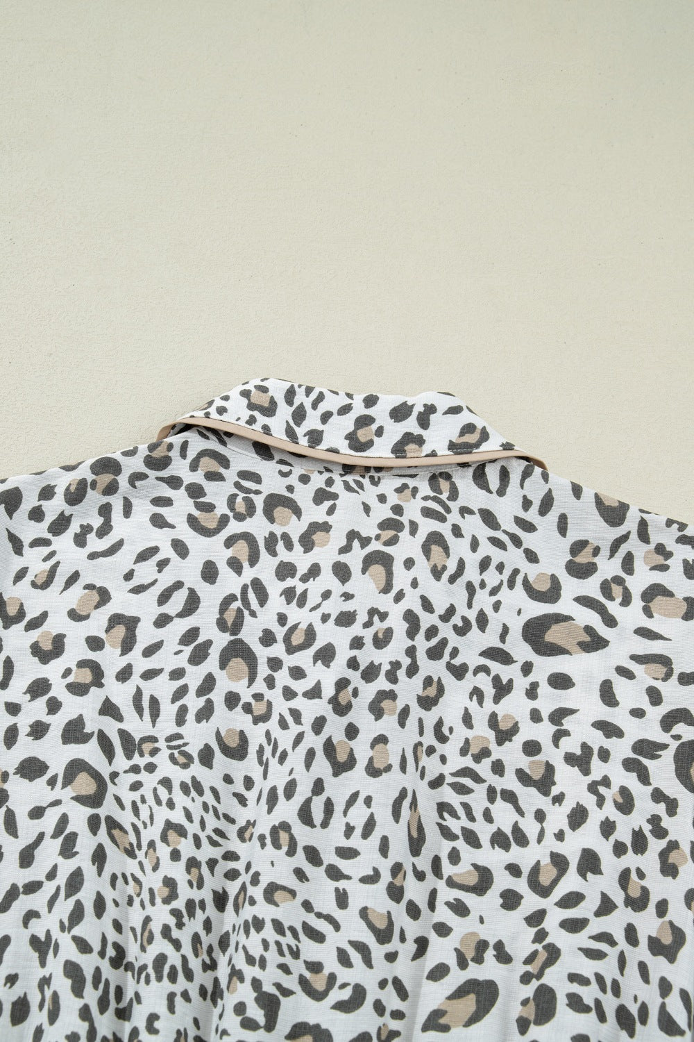 Women's leopard print button-down midi dress by Trendsi, casual chic viscose blend fabric, featuring a stylish collar and long sleeves.