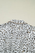 Women's leopard print button-down midi dress by Trendsi, casual chic viscose blend fabric, featuring a stylish collar and long sleeves.