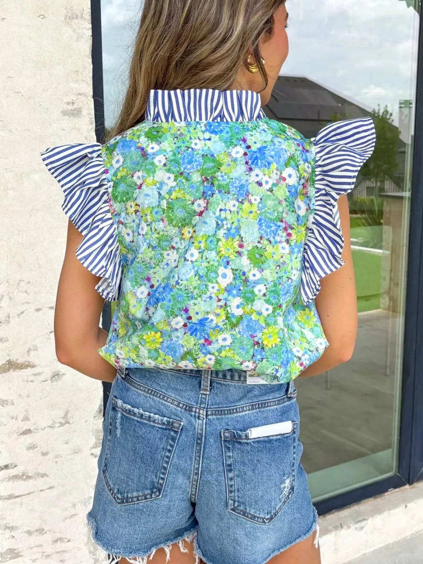 Floral patchwork cotton blouse with flutter sleeves and V-neck, casual dress by Trendsi, shown in vibrant fabric detail.