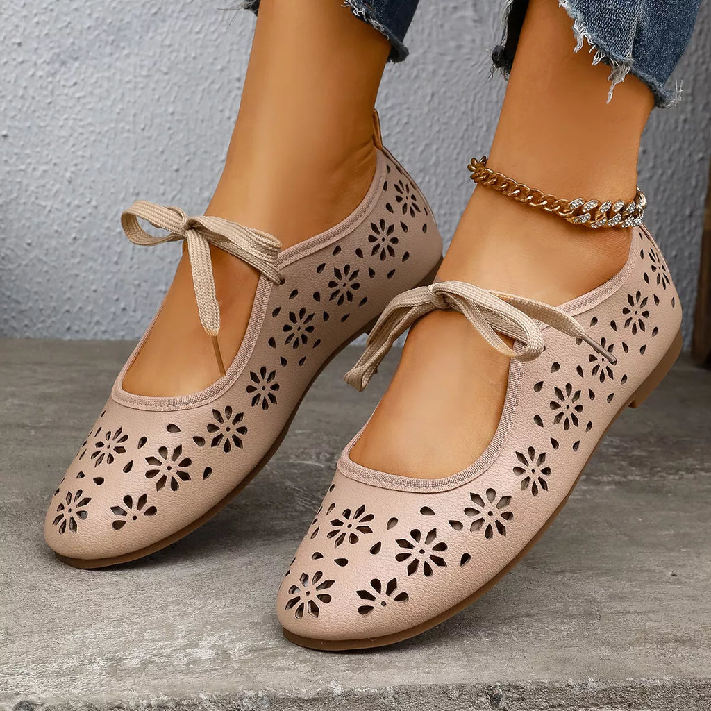 Floral cutout tied slip-on sandals by Plush Fashion Hub featuring open-toe design and decorative floral cutouts.