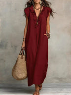 Ruffled V-neck maxi dress in flowing fabric from Plush Fashion Hub, featuring a stylish ruffled neckline and elegant design.