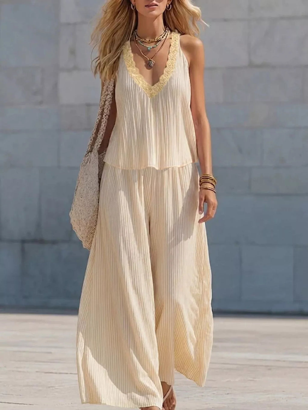 Striped V-neck tank top and wide-leg pants set by Shopimist, featuring a stylish two-piece outfit with bold stripe pattern.