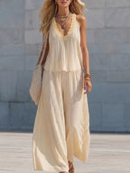 Striped V-neck tank top and wide-leg pants set by Shopimist, featuring a stylish two-piece outfit with bold stripe pattern.