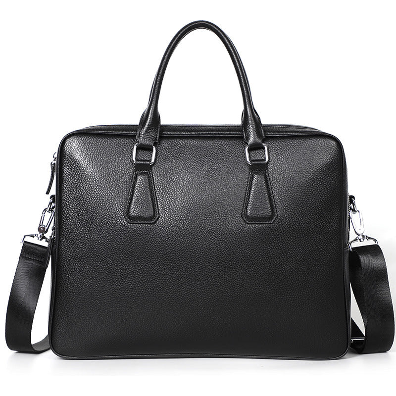 Men's leather briefcase by Plush Fashion Hub, large-capacity cowhide handbag with horizontal design and sturdy handles.