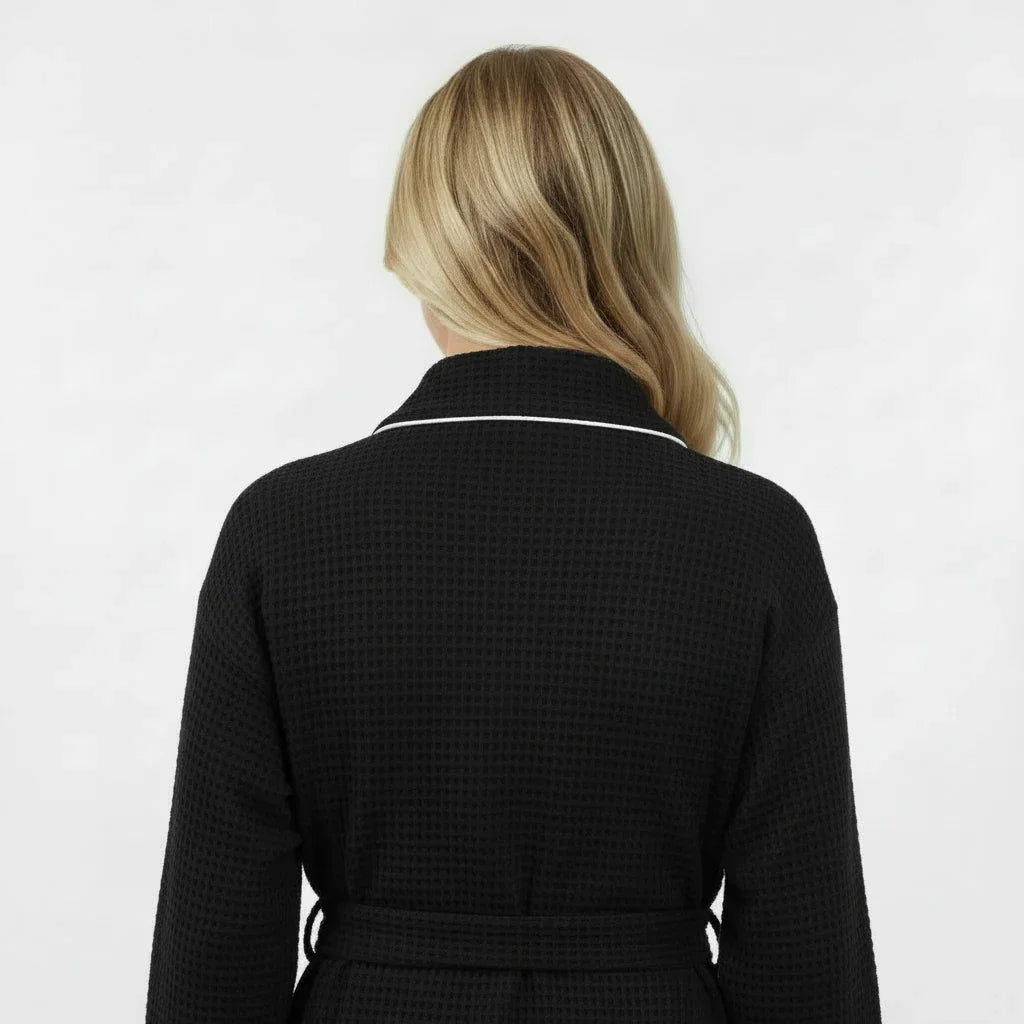 Back view of women's lightweight black waffle piping bathrobe from Plush Fashion Hub, spa-style comfort with piping details.