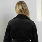 Back view of small black women's plush bathrobe by Plush Fashion Hub, showcasing soft, cozy fleece material and relaxed fit.