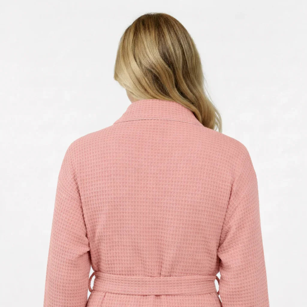 Back view of a plush blush knee-length waffle robe for women by Plush Fashion Hub, showing the textured fabric and relaxed fit.