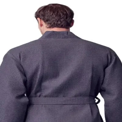 Back view of Plush Fashion Hub men's charcoal waffle spa bathrobe, lightweight and absorbent, shown hanging on a hook.