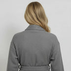 Dark grey knee-length waffle robe for women by Plush Fashion Hub, showing the back view of a cozy kimono-style robe.