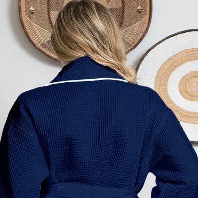 Navy women's plush bathrobe with piping, soft waffle fabric, and small size, from Plush Fashion Hub, shown from the back.
