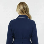 Navy women's waffle piping bathrobe from Plush Fashion Hub, lightweight spa-style robe with back detail and piping accents.