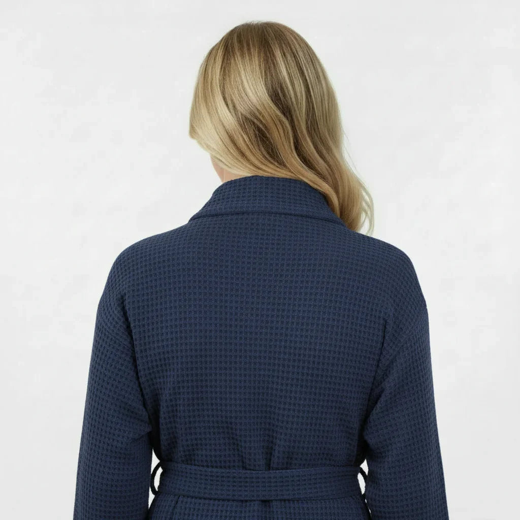 Back view of navy knee-length waffle robe for women by Plush Fashion Hub, showing textured fabric and relaxed fit.