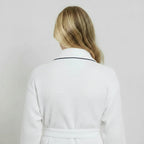 White women's waffle piping bathrobe from Plush Fashion Hub, lightweight spa-style robe with small size and back piping detail.