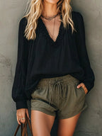 Plush Fashion Hub Frill V-Neck Long Sleeve Blouse, stylish shirt with ruffled details and a V-neck design, in a soft fabric.