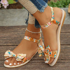 Floral bowknot ankle strap flat sandals for women, trendy summer shoes, comfortable and stylish by Trendsi.