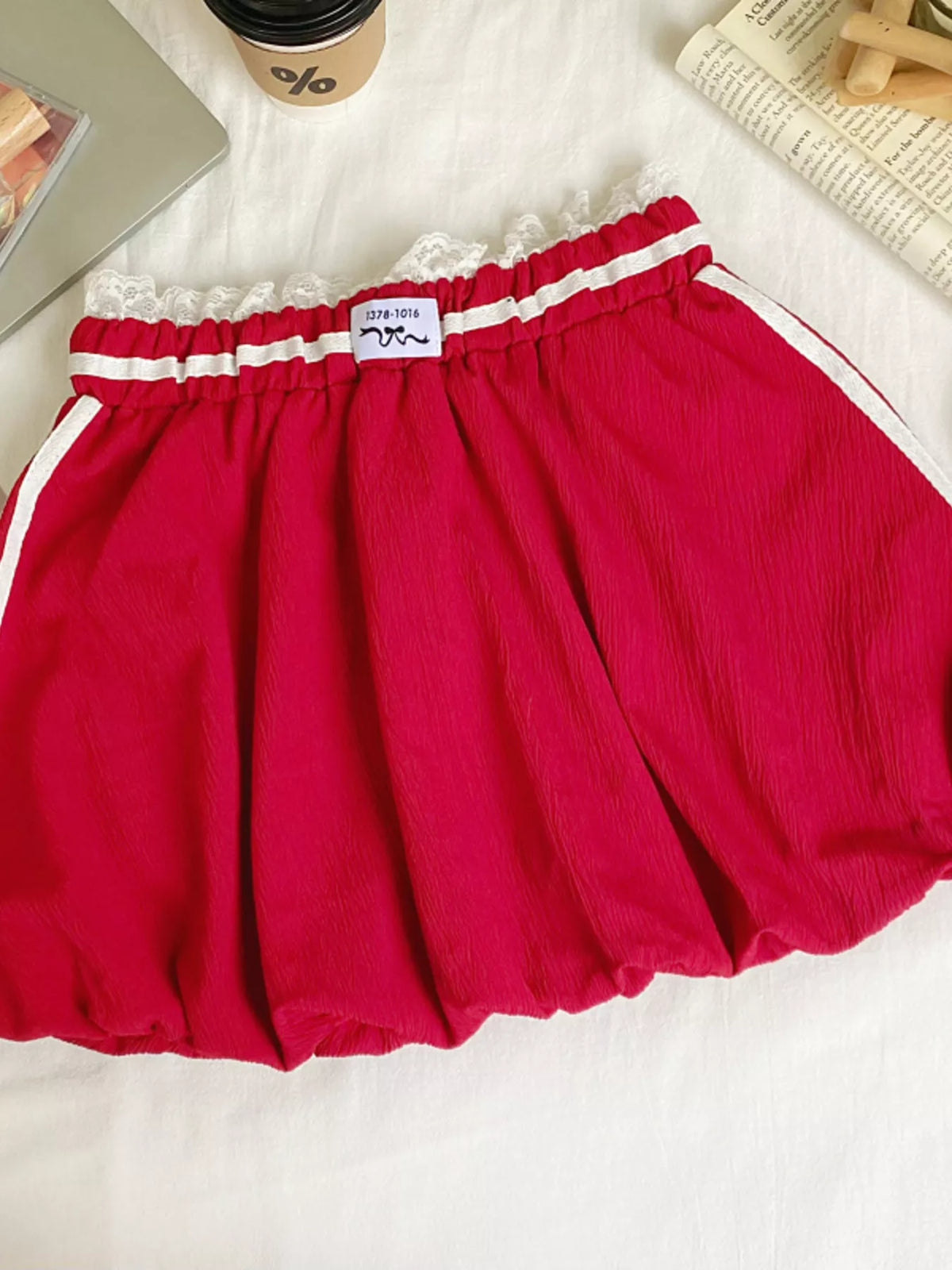 Lace trim elastic waist mini skirt in soft fabric by Plush Fashion Hub, featuring a stylish and comfortable design.