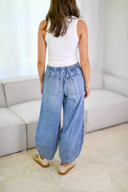 Plush Fashion Shop denim drawstring jeans with front pockets, casual fit, and classic blue denim fabric.