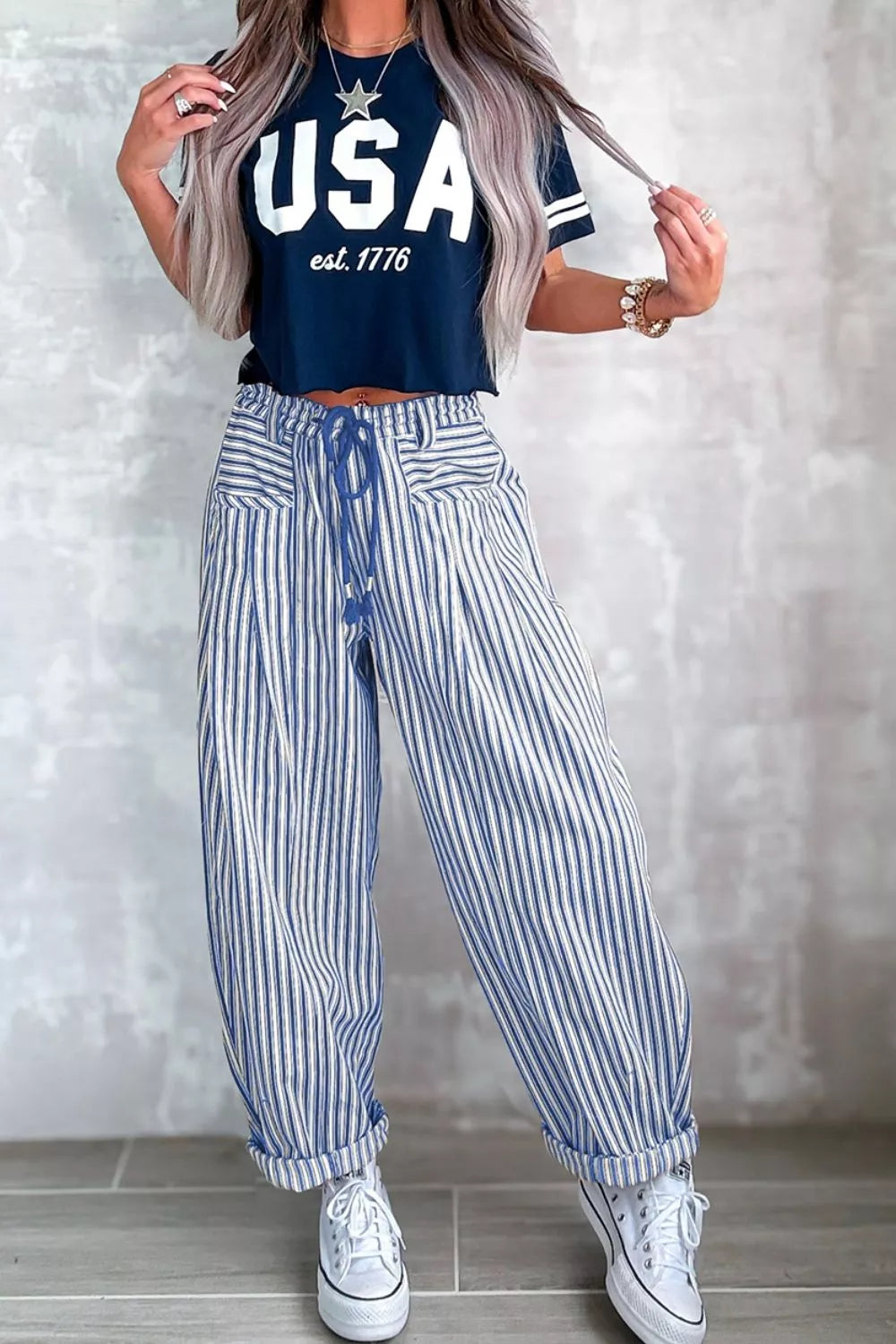 Light gray stripe drawstring casual loose pants from Trendsi, featuring a relaxed fit and adjustable waist for comfortable wear.