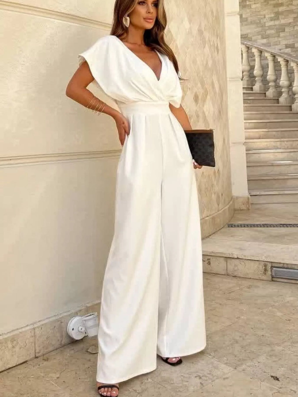 Shopimist surplice wide leg jumpsuit with flowing fabric and V-neck, perfect for stylish, comfortable summer wear.