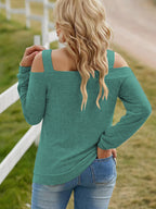 Women's elegant cold shoulder blouse by Trendsi featuring cutout details and a chic casual polyester top design.