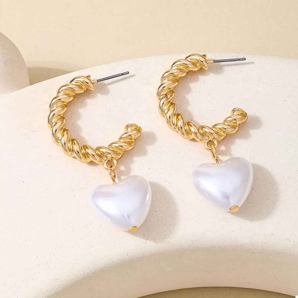 18K gold-plated C-hoop heart earrings with delicate design, featuring shiny gold finish and secure clasp.