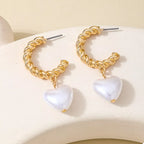18K gold-plated C-hoop heart earrings with delicate design, featuring shiny gold finish and secure clasp.