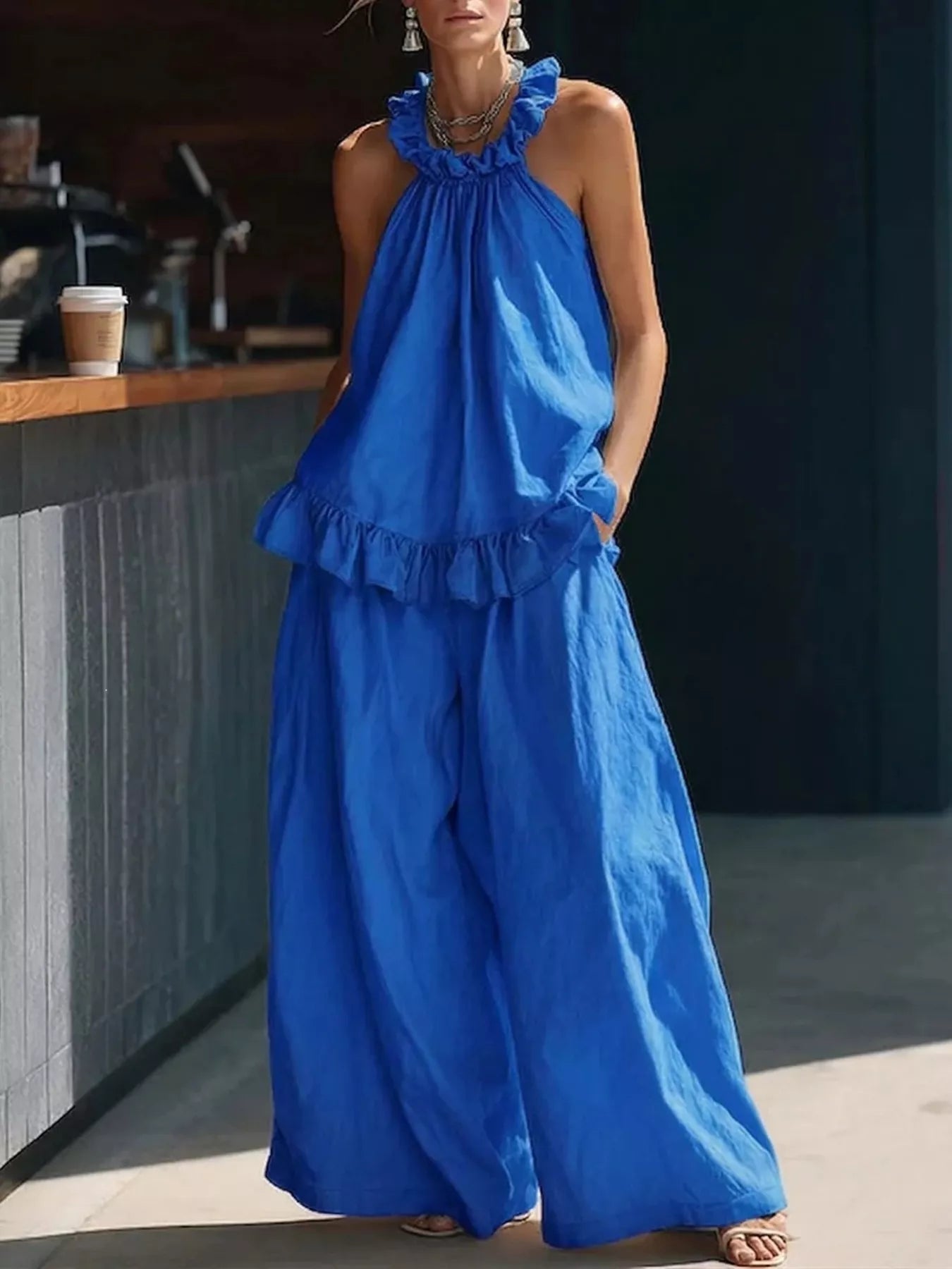 Plus size ruffled halter neck top with wide-leg pants set by Plush Fashion Hub, stylish and comfortable for casual wear.