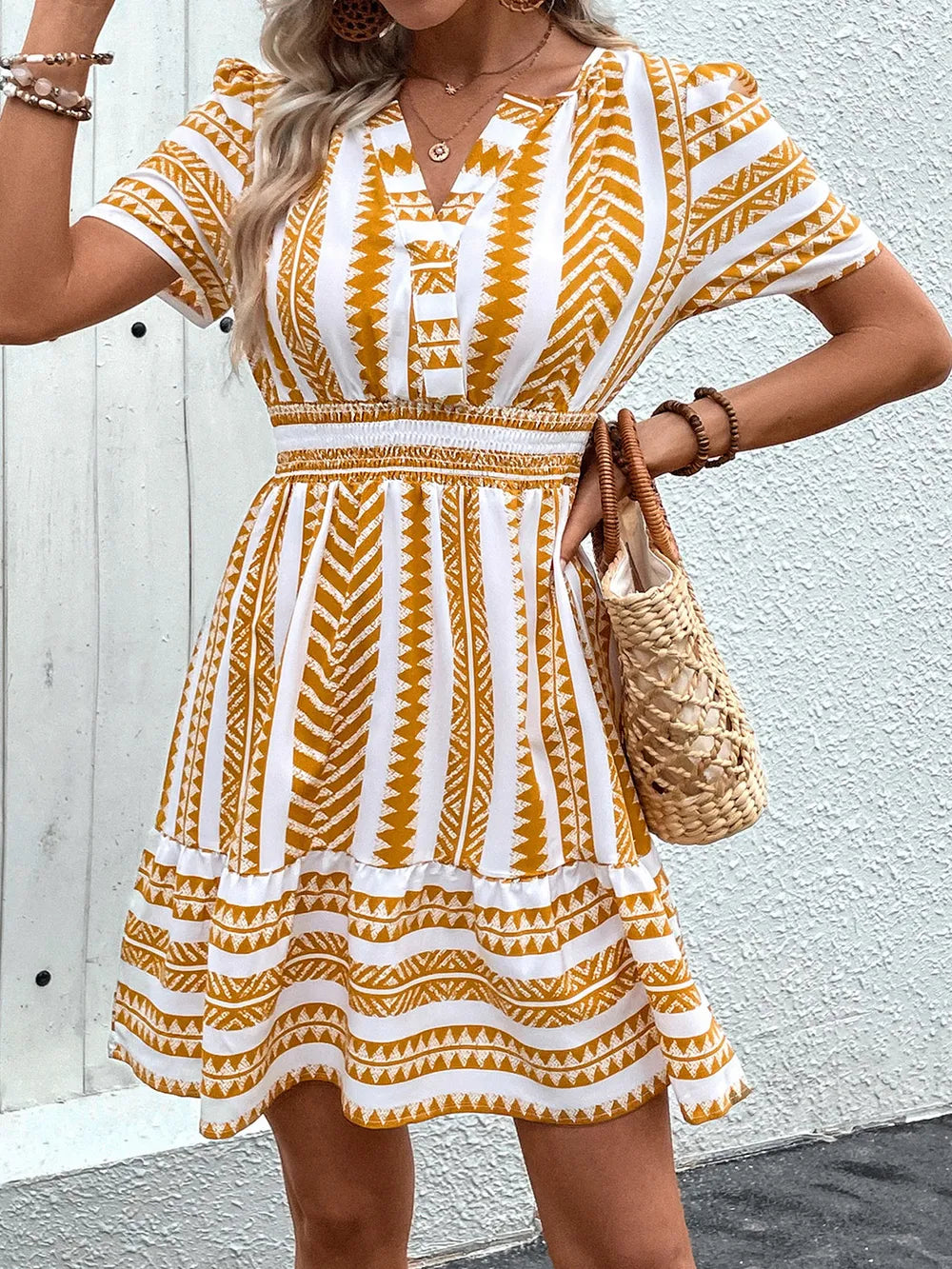 Plush Fashion Hub geometric notched short sleeve mini dress featuring a modern, stylish design with a fitted silhouette and bold pattern.