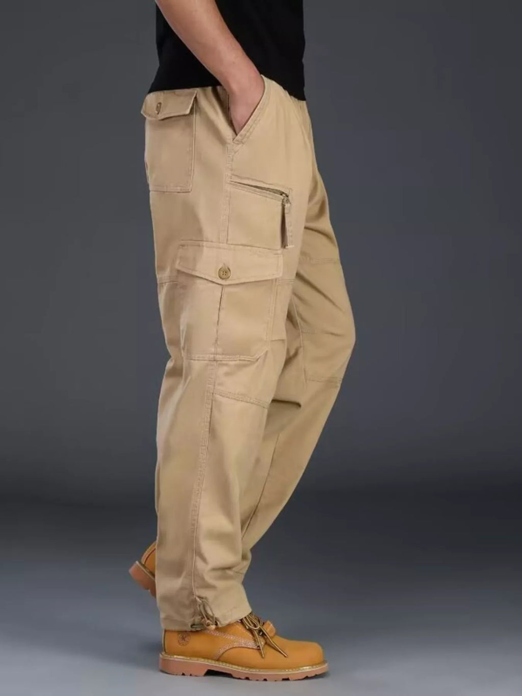 Men's plus size casual cargo pants by Trendsi, featuring multiple pockets and relaxed fit, shown in a comfortable and stylish design.