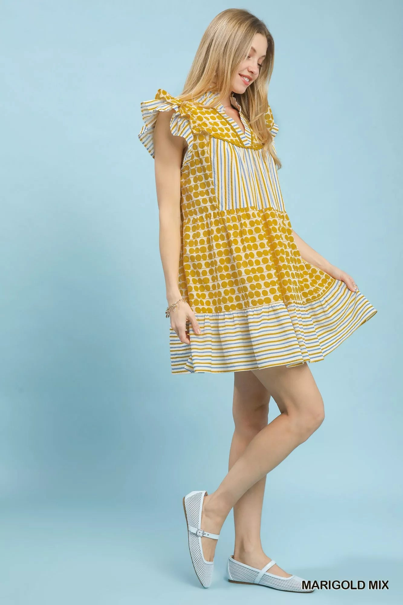 Umgee Mix Patchwork Flutter Sleeve Tiered Dress, stylish boho dress with patchwork design and flutter sleeves on a model.