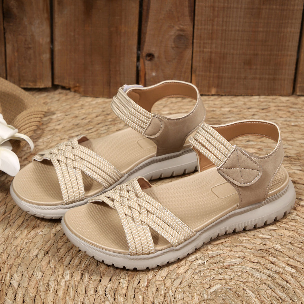 Women's open toe woven strap flat sandals with faux leather slides, featuring a comfortable design and stylish casual footwear.
