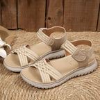 Women's open toe woven strap flat sandals with faux leather slides, featuring a comfortable design and stylish casual footwear.
