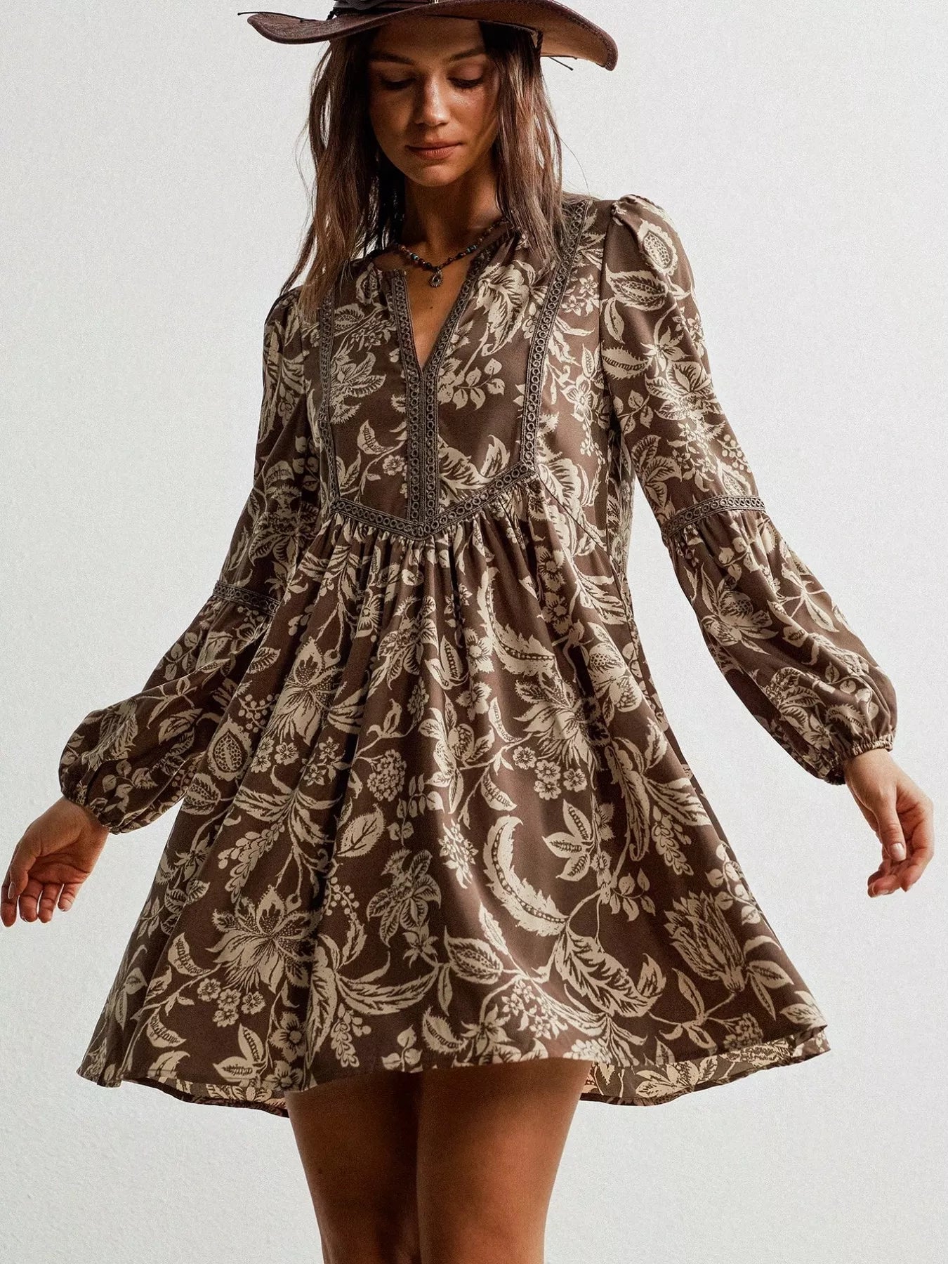 Plus size printed notched long sleeve dress by Shopimist featuring a vibrant pattern and a stylish notched neckline.