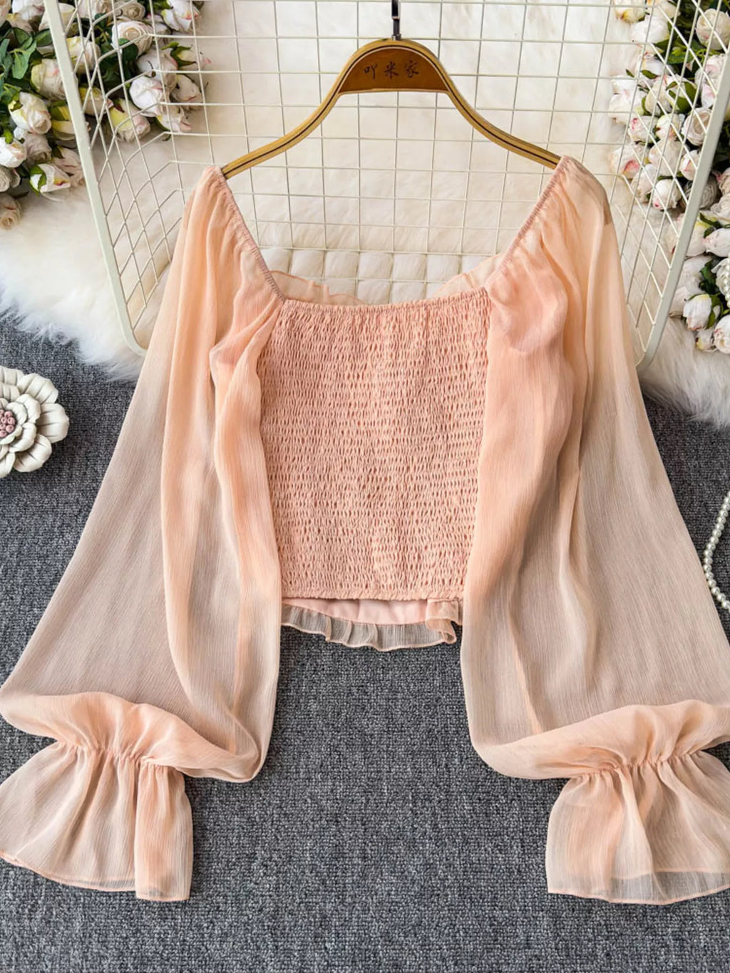 Women's elegant frill flounce sleeve smocked blouse made of lightweight polyester, stylish dress with feminine detailing.