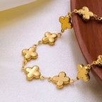 18K gold-plated clover charm necklace with delicate chain and four-leaf clover pendant, styled for elegant jewelry wear
