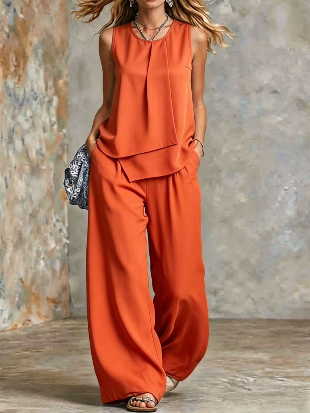 Women's sleeveless two-piece set with solid color wide-leg pants and matching top, stylish and comfortable from Plush Fashion Hub.
