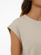 Women's plush lounge set with round neck, cap sleeves, and drawstring shorts from Plush Fashion Hub, shown on a model.