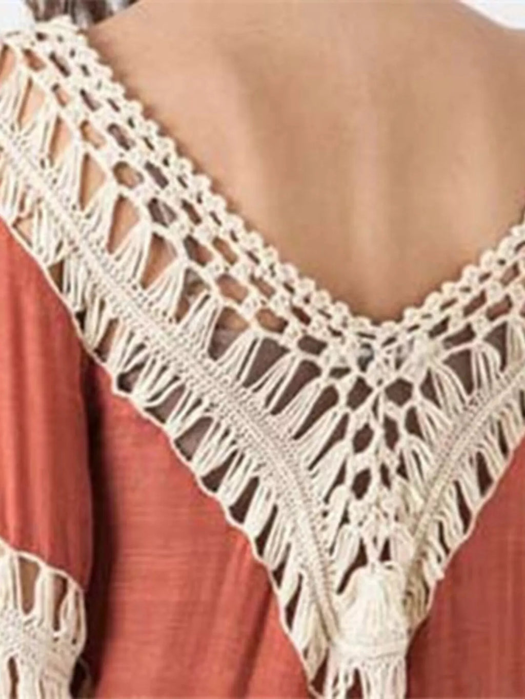 Crochet-trimmed long sleeve swim cover-up from Trendsi, lightweight and breezy for beach or poolside wear.