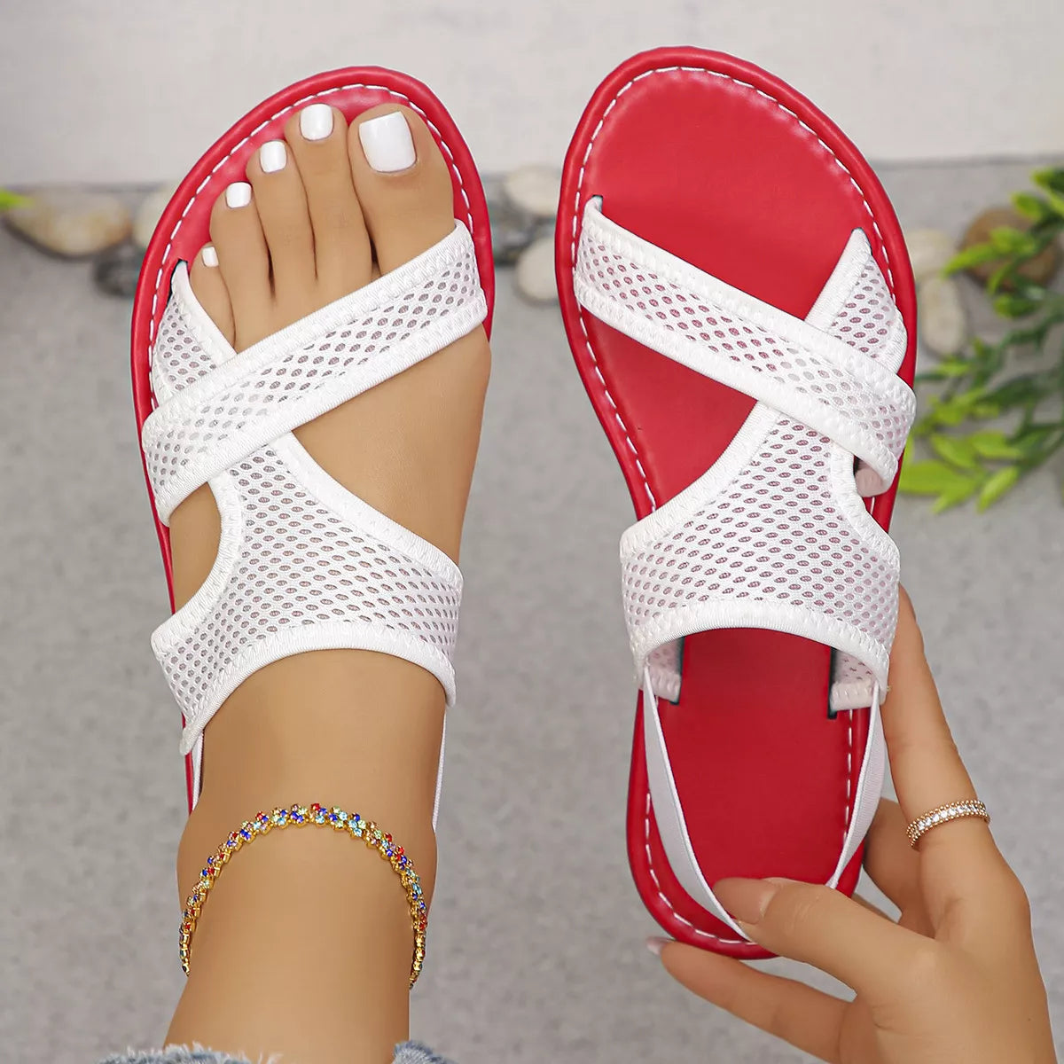 Shopimist crisscross mesh sandals with open toe design and adjustable ankle straps on a beige background.